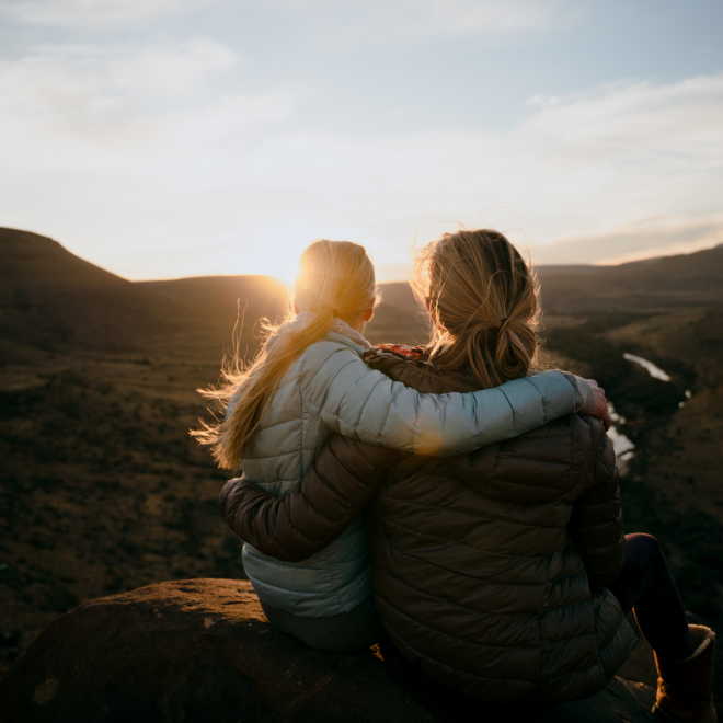 Two ladies hugging